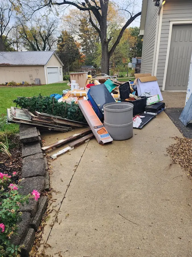 Dumpster being loaded with debris for 30 Yard Dumpster Rental in Reedsport